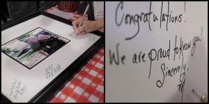 A&J framed picture with signatures from anniversary party 