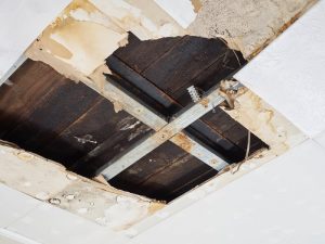 Bathroom pipe leaking down into kitchen | Water damage restoration services by A&J Property Restoration DKI of Madison, Middleton, Sun Prairie, Waunakee, Milwaukee, WI Dells, Fort Atkinson, Watertown, and Waukesha, Wisconsin