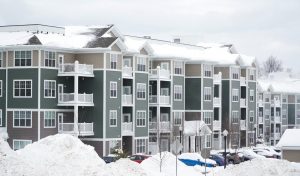 commercial apartment buildings covered in snow