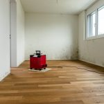 empty room with mold on walls and dehumidifier